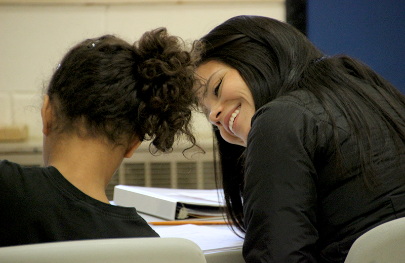 Teacher helping student